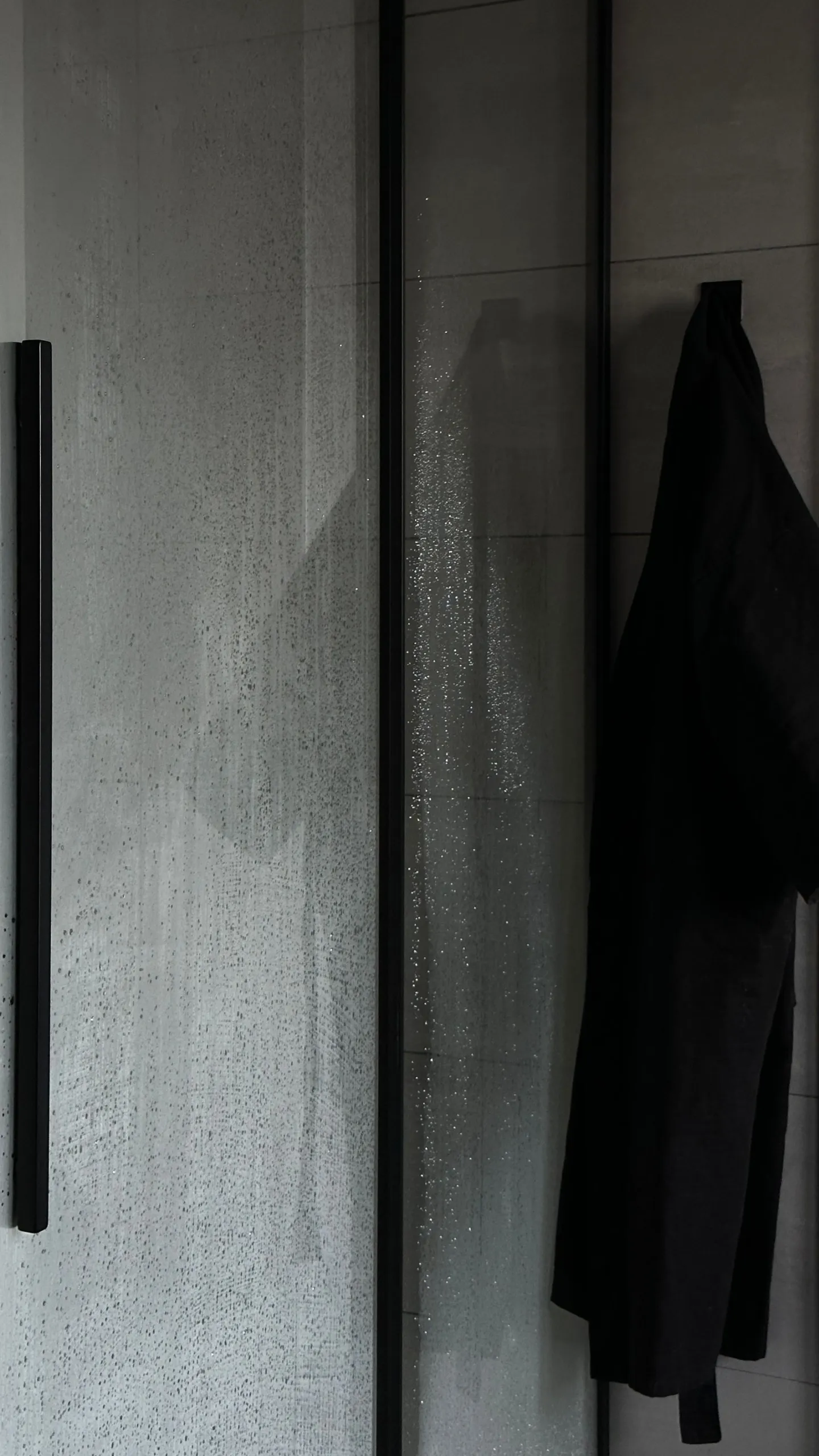 Glass shower door in a modern bathroom